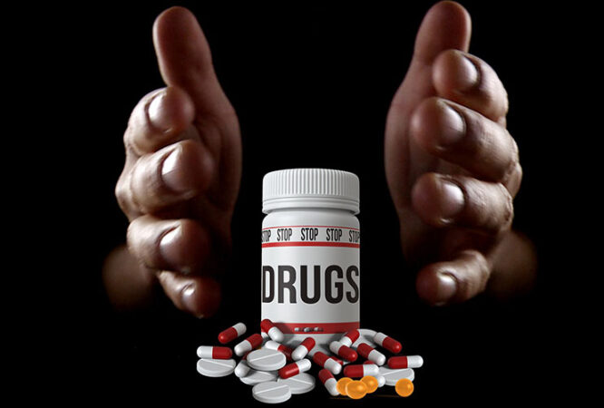 hands surrounding a drugs container